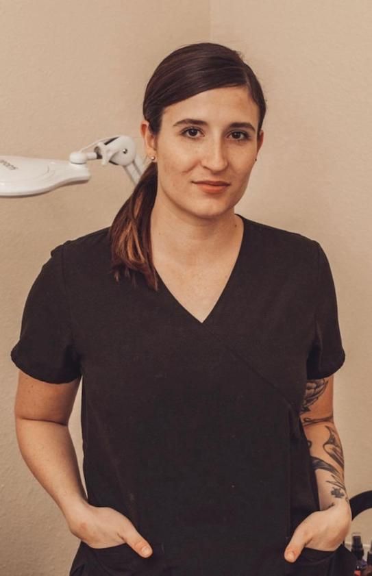 Kaitlin in black scrub top
